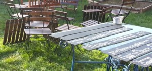 A jumble of chairs and a table of blackboards